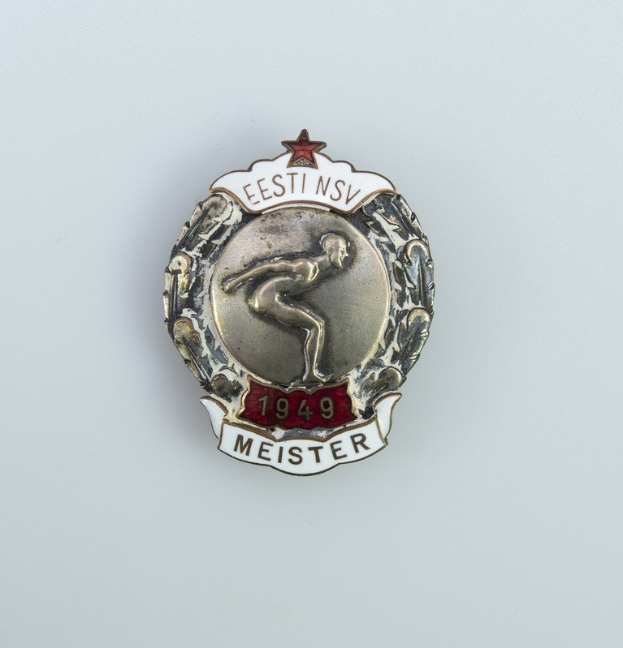 Silberner Stern mit roter Stern und Text, Emblem der Olympischen Spiele 1949 in Deutschland.