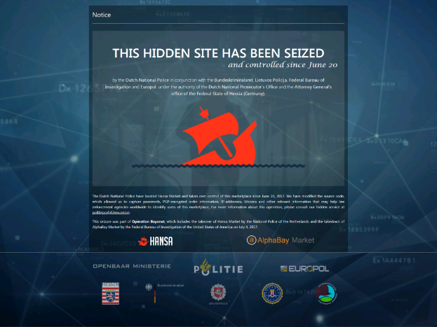 Ein Computerbildschirm mit einer Nachricht, die in fetter, schwarzer Schrift mit einem weißen Rand und einem Logo der niederländischen Nationalpolizei mit einem Schild mit blauem Hintergrund und einem weißen Stern in der Mitte angezeigt wird.